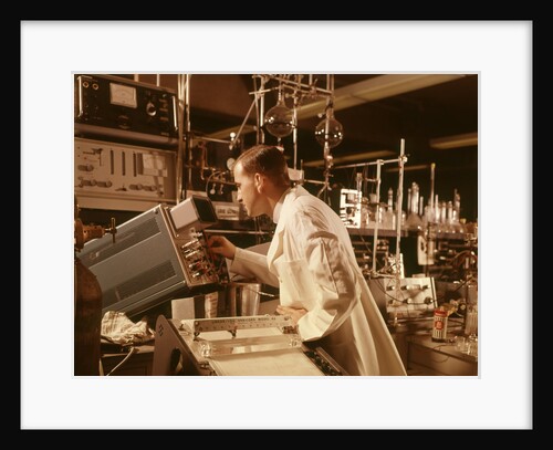 1960s Scientist Lab Technician Looking Into Oscilloscope In Laboratory by Anonymous