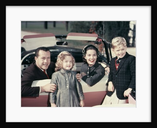 1950s Portrait Family Father Mother Son Daughter Sitting In Red White Convertible Automobile by Anonymous
