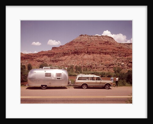 1970s Station Wagon Trailer Rv New Mexico Highway Tourist Man Woman By Mesa Formation Airstream by Anonymous
