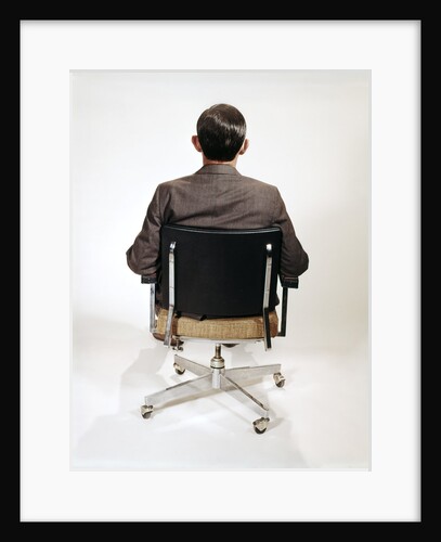 1960s Business Man Back View Sitting In Office Chair by Anonymous