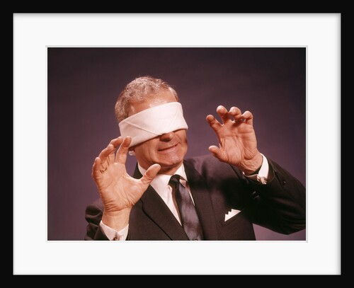 1960s Blindfolded Senior Man Businessman Arms Reaching Grasping Feeling Way by Anonymous