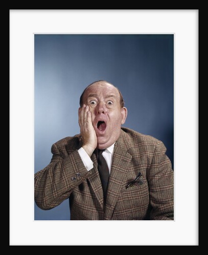 1960s Balding Businessman Holding Hand Up To Face Shocked Expression Eyes Bulging Mouth Open by Anonymous