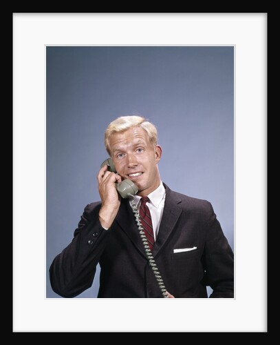 1960s Young Businessman Salesman Talking On Telephone by Anonymous