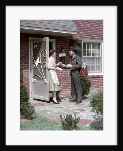 1950s Mailman Delivering Mail To Woman Brick Suburban Home by Anonymous