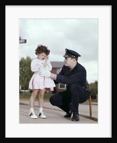 1960s Man Police Officer Comforting Crying Scared Little Lost Girl In Suburban Neighborhood by Anonymous
