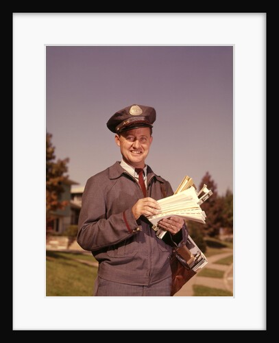 1960s Mailman Holding Letters Mail Leather Mailbag In Suburban Neighborhood by Anonymous