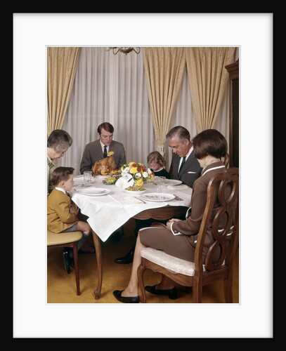 1960s 1970s Three Generation Family Saying Grace Prayer At Thanksgiving Dinner by Anonymous