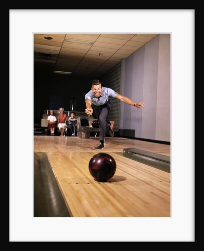 1960s Man In Good Form Releasing Bowling Ball Down Lane Wife Woman 2 Kids Behind Him by Anonymous