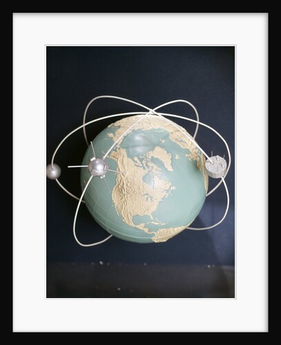 1950s 1960s Model Of Satellites Orbiting The Globe by Anonymous