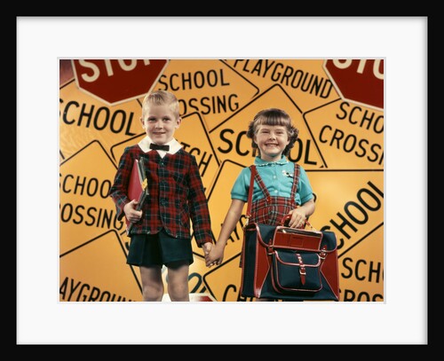 1950s Girl And Boy With Book Bag And Books Holding Hands Together In Front Of School by Anonymous