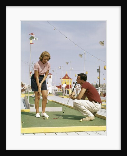 1950s 1960s Young Couple Man Woman Play Miniature Golf Summer Amusement by Anonymous