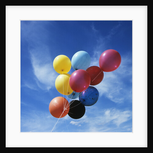 Bunch Of Multi Colored Balloons Against A Blue Sky by Anonymous