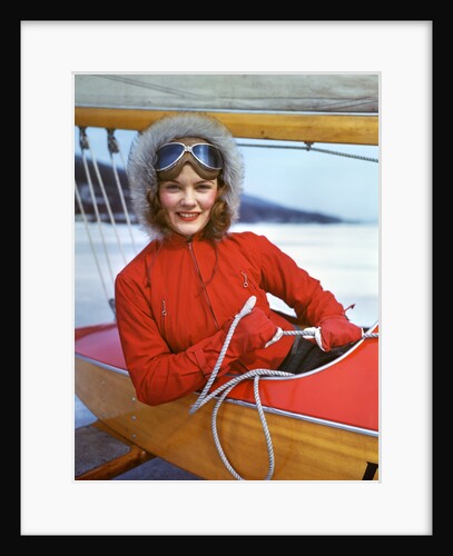 1940s Young Woman Sitting In Cockpit Of Ice Boat Holding Sheet Rope To Sail Boom by Anonymous