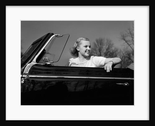 1930s 1940s Pretty Teenage Woman Sitting In Convertible Automobile Driver Seat by Anonymous