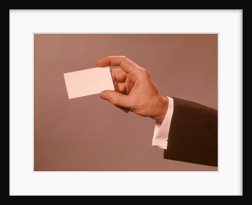 1960s 1970s Man Hand Holding Blank Business Card by Anonymous