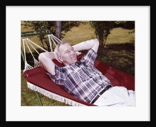 1960s Older Man Lying In Hammock In Backyard Retired Lifestyle Leisure by Anonymous