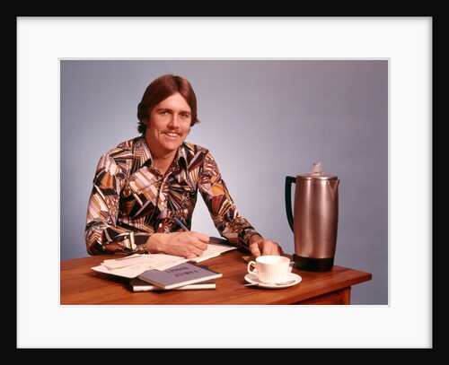 1970s Young Man Mustache Loud Print Shirt Desk Empty Coffee Cup Pot Family Budget by Anonymous