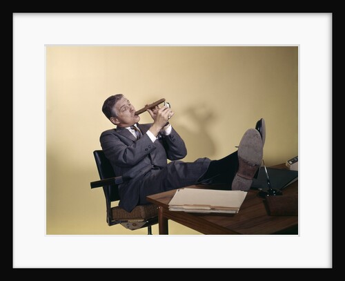 1960s Successful Businessman With Look Of Satisfaction Sitting With Shoes Propped On Desk by Anonymous