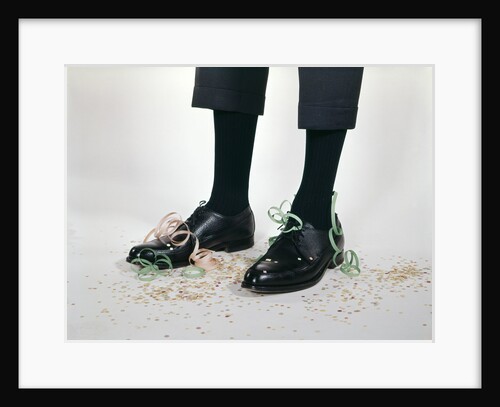1960s Humor Story Close-Up Detail Of Man's Legs With Pants Too Short And Confetti On Shoes Man by Anonymous