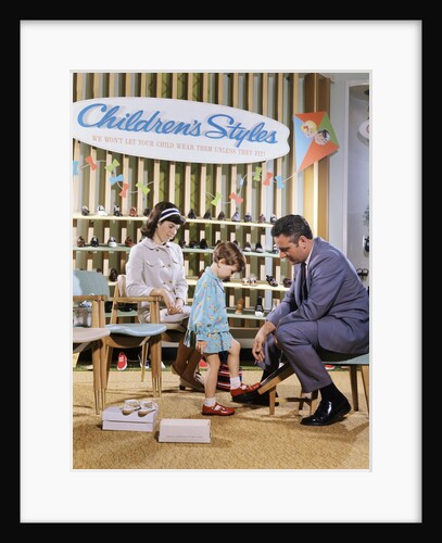 1960s 1970s Mother Watching Salesman Fit Shoes On Daughter In Shoe Section Of Department Store by Anonymous