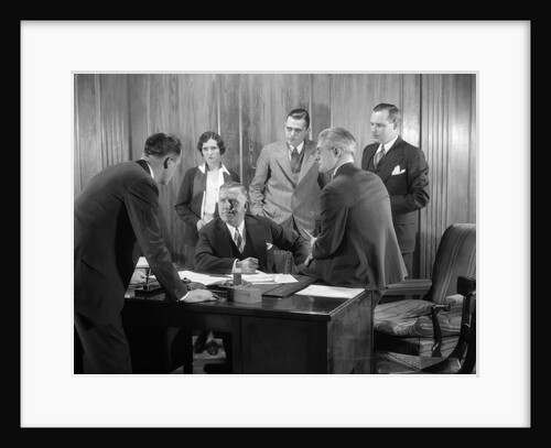 1930s Worried Business Group In Office Meeting Around The Boss' Desk by Anonymous
