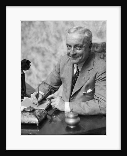 1920s 1930s Man Businessman,Salesman Sitting At Desk Smoking Cigar Writing A Memo by Anonymous