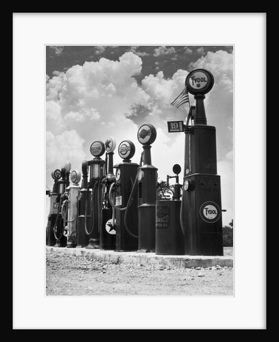 1920s 1930s Line Of Gasoline Pumps by Anonymous