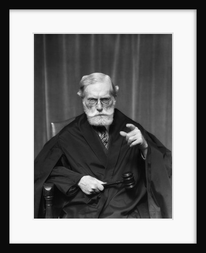 1930s Stern Elderly Judge With Beard And Glasses Pointing At Camera by Anonymous