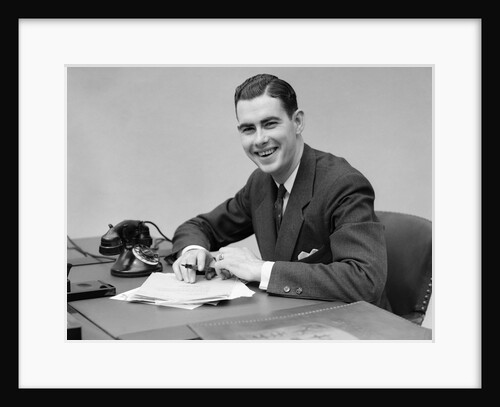 1930s Man Sitting At Desk In Office Holding Pen by Anonymous