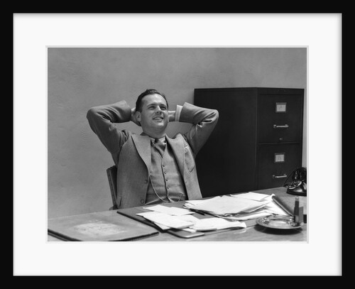 1930s 1940s Man Businessman Relaxing At Desk In Office by Anonymous