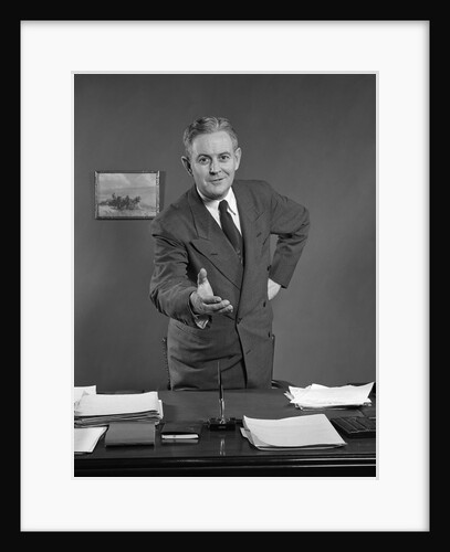 1950s Man Businessman Salesman Reaching Across Desk To Shake Hands by Anonymous