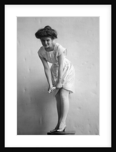 1900s 1910s Woman With Gibson Girl Hair Style Ringing Out Wet Chemise Hemline by Anonymous