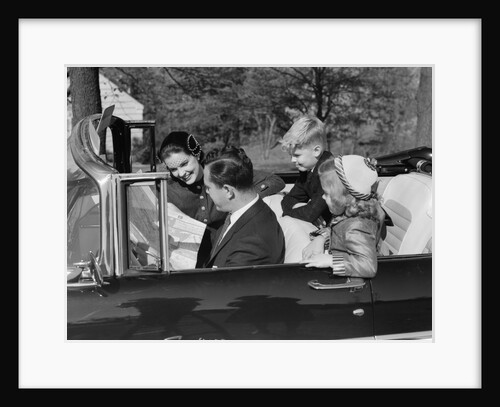 1950s Family Father Mother Daughter Son In Convertible Reading Map by Anonymous