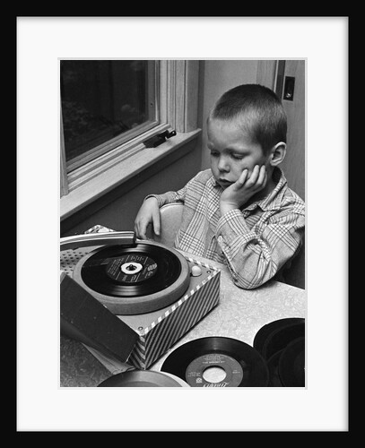 1960s 1970s Boy With Buzz Haircut Listening To Music On Portable 45 RPM Phonograph Record Player by Anonymous