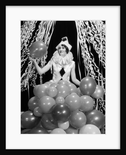 1920s 1930s Young Woman Pierrot Clown Amid Party Balloons And Paper Streamers by Anonymous