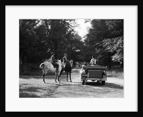 1920s 1930s Couple On Horses Meeting Woman On Road In Convertible Touring Car by Anonymous