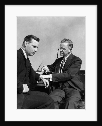 1930s Man Doctor Taking Pulse Of Man Patient by Anonymous