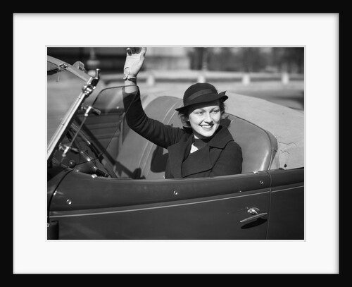 1930s Woman Driving Convertible Roadster Automobile Waving Gloved Hand by Anonymous