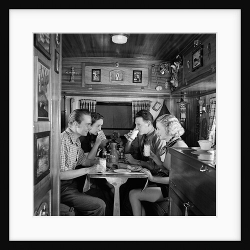 1930s Two Couples Sitting Inside Camping Trailer Eating Lunch by Anonymous
