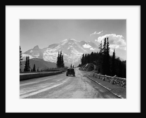 1930s Sedan Automobile Driving High Mountain Road Towards Snow Capped Mount Rainier Washington State Usa by Anonymous