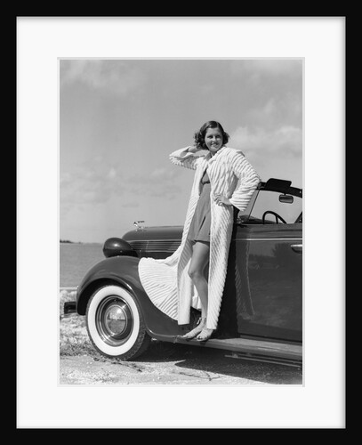 1930s 1940s Woman Wearing Chenille Beach Robe Posing On Running Board Of Convertible Roadster Automobile by Anonymous