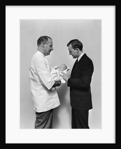 1930s 1940s Man Doctor Showing New Born Infant Baby To Proud Father by Anonymous