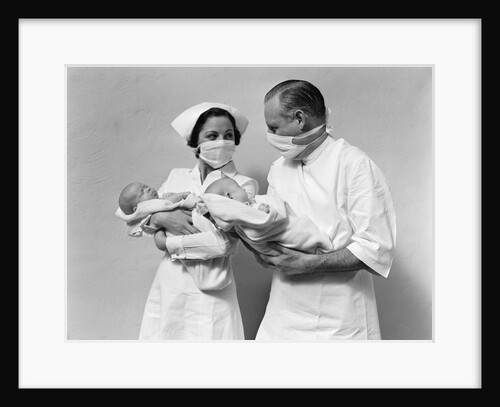 1930s 1940s Man Doctor Woman Nurse Wearing Sterile Masks Holding Newborn Infant Twin Babies by Anonymous