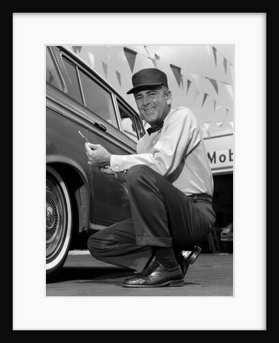 1950s 1960s Gas Station Attendant Checking Tire Pressure by Anonymous