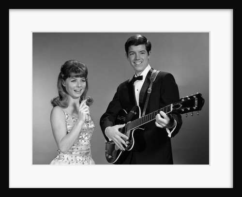 1960s Teenage Entertainment Duo Man Playing Guitar And Woman Singing Holding Microphone by Anonymous