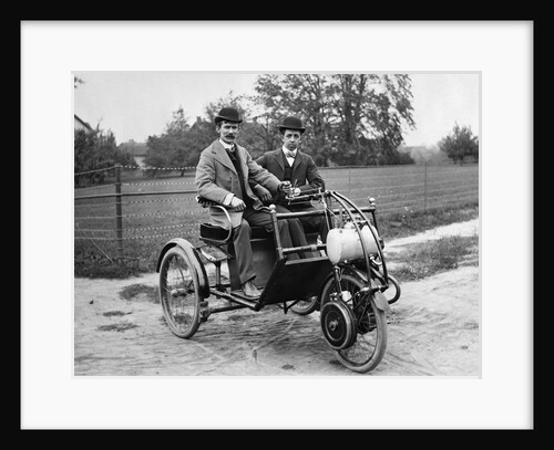1900s Two Men In Bowler Hats Sitting In Three Wheel Motorized Horseless Carriage by Anonymous
