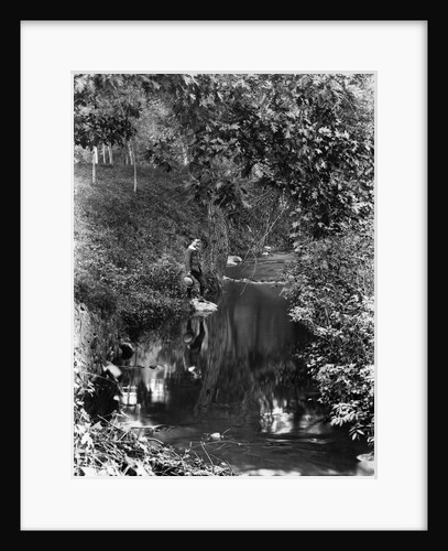 1890s 1900 Boy Standing In Wooded Area Looking Down At Reflection In Creek by Anonymous