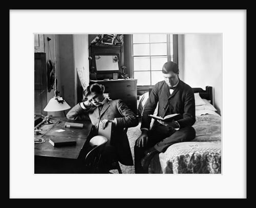 1890s Pair Of Male Students Studying In Dorm Room by Anonymous