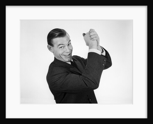 1950s 1960s Businessman Hands Clasped Overhead In Successful Winner Symbolic Sign by Anonymous