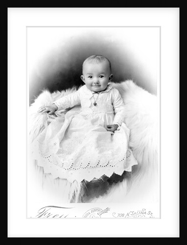 1890s 1900 Portrait Baby In Long Dress Wearing Heart Locket Sitting On White Fur Blanket by Anonymous